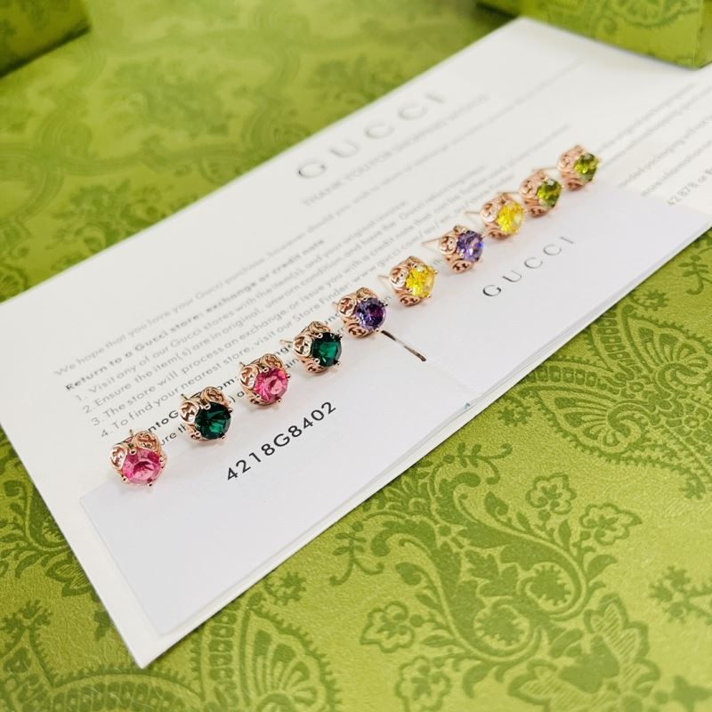G*u*i earrings